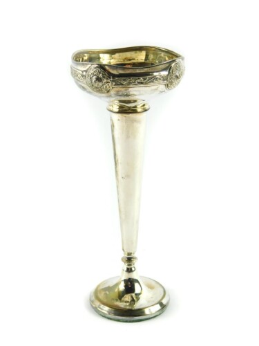 A George V loaded silver bud vase, of trumpet form embossed with a Celtic band, Henry Matthews, Birmingham 1912, 3.6oz all in.