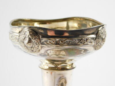 A George V loaded silver bud vase, of trumpet form embossed with a Celtic band, Henry Matthews, Birmingham 1912, 3.6oz all in. - 3