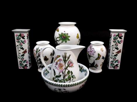 A group of Portmeirion pottery decorated in the Botanic Garden pattern, comprising a pair of baluster vases, 17cm high, further baluster vase 26cm high, milk jug and fruit bowl, and a pair of rectangular vases with flared rims, 23cm high. (7)