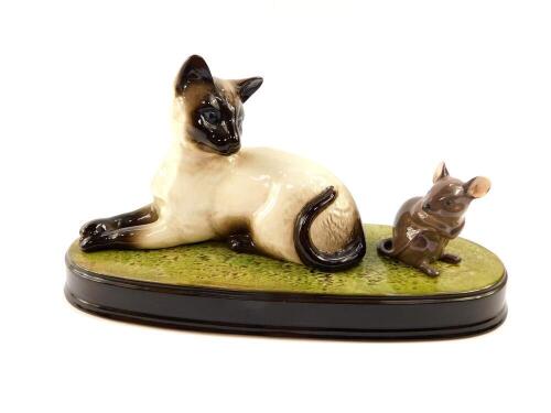 A Beswick pottery figure modelled as a "Watchit", with a Siamese cat and mouse, on an oval base, no. 1558/1678.