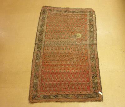 A Persian rug with a design of both on a red ground