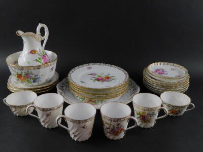 A group of Dresden porcelain tea and coffee wares, painted with sprays of flowers, gilt heightened, comprising bread plate, milk jug and sugar bowl, seven cups, eight saucers and nine tea plates. - 2