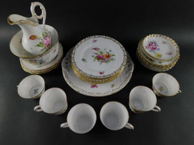 A group of Dresden porcelain tea and coffee wares, painted with sprays of flowers, gilt heightened, comprising bread plate, milk jug and sugar bowl, seven cups, eight saucers and nine tea plates. - 3