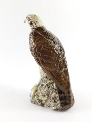 A Beswick Beneagles scotch whiskey decanter, modelled as an osprey, designed by D Lyttleton 1977, and a further Beneagles scotch whiskey decanter for Peter Thomson (Perth Limited) modelled as a curling stone. (2) - 6