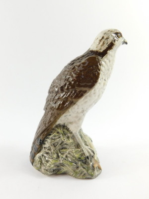 A Beswick Beneagles scotch whiskey decanter, modelled as an osprey, designed by D Lyttleton 1977, and a further Beneagles scotch whiskey decanter for Peter Thomson (Perth Limited) modelled as a curling stone. (2) - 7