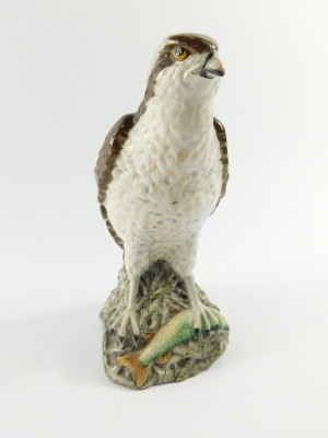 A Beswick Beneagles scotch whiskey decanter, modelled as an osprey, designed by D Lyttleton 1977, and a further Beneagles scotch whiskey decanter for Peter Thomson (Perth Limited) modelled as a curling stone. (2) - 8