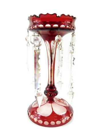 A Continental ruby painted cut glass lustre, with clear prismatic cut drops, 27cm high.