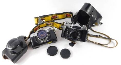 A Canon Canonet camera, together with a Zenit-E camera, Moshea .80, both cased. (2)