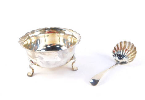 An Edward VII silver sugar bowl, raised on three cabriole legs, London 1904, and a silver sugar sifter spoon, Chester 1908, 3.47oz.