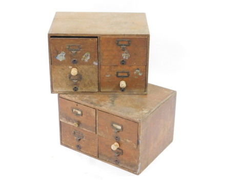 A pair of early 20thC oak index card chests, each of four drawers, 31.5cm high, 47.5cm wide, 35cm deep.