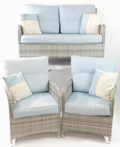 A Dobbies Lloyd Loom style three piece conservatory set, in grey, with turquoise and striped cushions, comprising two seater sofa, 137cm wide, and a pair of armchairs.