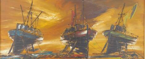 Hawkes (British, late 20thC). Three fishing boats moored at low tide, sunset beyond, oil on board, scratch signed, 29cm x 69.5cm.