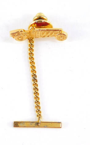 A 9ct gold vintage motor car tie pin, with a yellow metal back and safety pin, pin 1.0g.