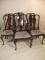 A set of six walnut dining chairs in the Queen Ann style