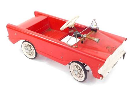 A Tri-ang toy pedal car, red and white chassis, registration LBL4242, with bell and horn, 86cm wide.