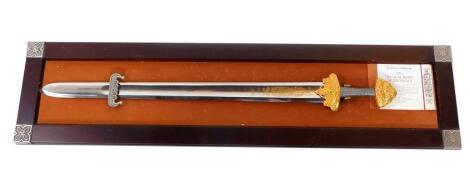 A Franklin Mint Replica The Treasure Sword of The Vikings, mounted and framed with certificate, 95.5cm long.