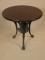 A cast iron pub table with an oak top