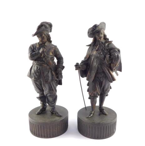 A pair of late 19thC spelter figures, modelled as King Charles I and Oliver Cromwell, raised on fluted circular bases, 33cm high.