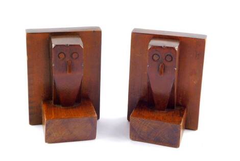 A pair of Art Deco oak bookends, carved as owls, 12.5cm high.