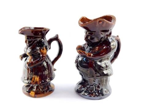 A Staffordshire 19thC treacle glazed character jug, modelled as the snuff taker, 24.5cm high and a further treacle glazed character jug modelled as Martha Gunn, 20cm high. (2, AF)