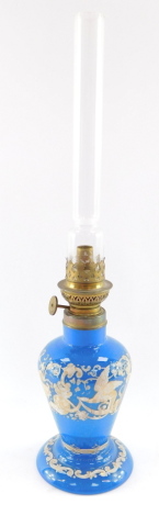 A Gaudard late 19thC blue glass oil lamp, with gilt and white enamel renaissance style decoration, with chimney, 44.5cm high.