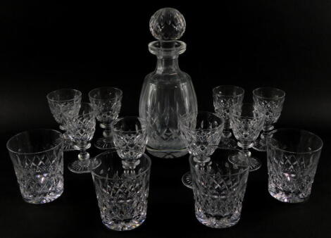 A Waterford cut glass decanter and stopper, decorated in the Lismore pattern, together with a part suite of Tudor table glass ware. (a quantity)