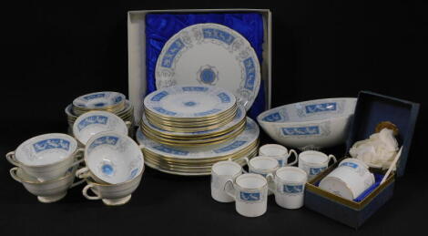 A Coalport porcelain part dinner and coffee service, decorated in the Revelry pattern, comprising six dinner, dessert and side plates, six soup cups and saucers, fruit bowl, cake plate, jam pot, pair of spoon dishes, six coffee cans and saucers and six pl