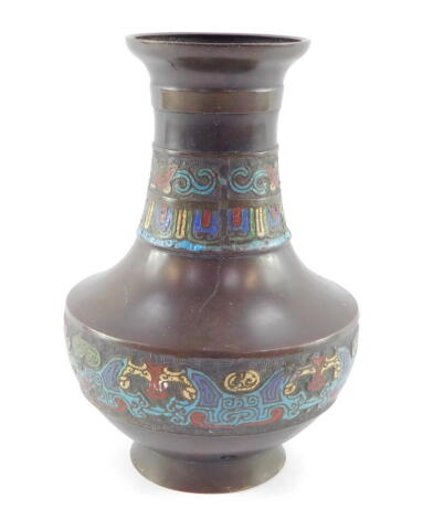 A Chinese Qing Dynasty bronze vase, with bands of cloisonne decoration, pierced for conversion into a table lamp, 23cm high.