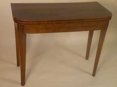 A George III mahogany tea table with boxwood stringing