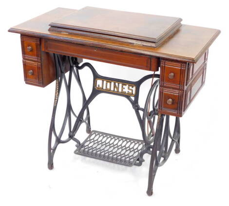 A Victorian Jones treadle sewing machine table, with cast iron base, 78cm high, 91cm wide, 45cm deep.