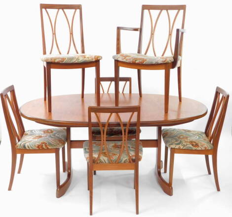 A G-Plan mid century oval draw leaf dining table, with one additional leaf, raised on curved end supports, 72cm high, 162.5cm wide, 208cm extended, 107cm deep., together with six teak dining chairs, with overstuffed floral cushion seats, comprising a carv