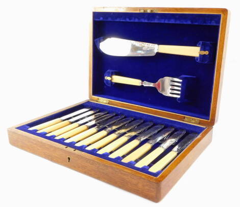 A silver plated fish canteen of cutlery with ivorine handles, cased.