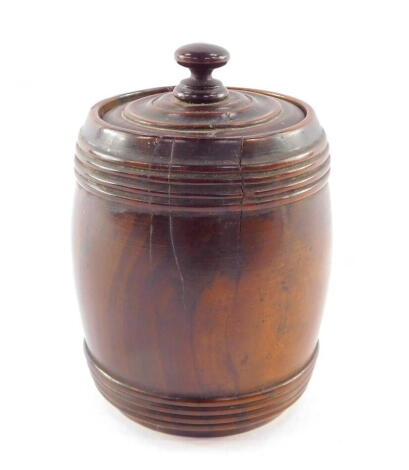 A Holy Land olive wood cylindrical barrel and cover, decorated with Hebrew script, 11cm high.