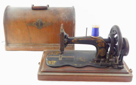 A Singer late 19thC model 12 sewing machine, serial number 7639637/1902237, cased.