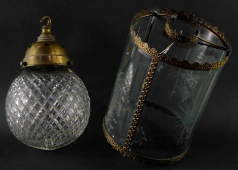 A late Victorian brass and cut glass hanging hall lantern, of globular form, 24cm high, together with a cut glass and brass cylindrical hall lantern, 26cm high. (2)