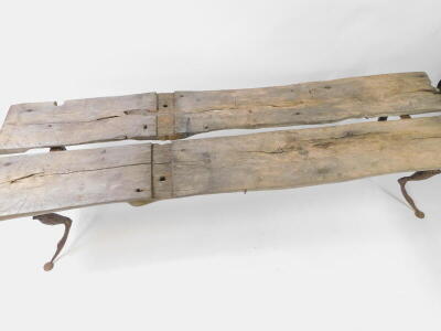 Andrew Thompson (British, 20thC/21stC). A wooden and cast iron bench, Preying Mantis, formed of two planks from a lock gate, raised on four cabriole legs, 54cm high, 188cm wide, 57cm deep. - 2