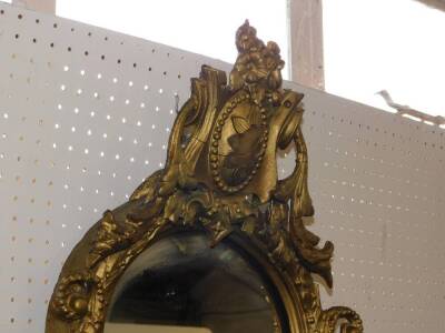 A 19thC gilt wood and gesso wall mirror, of quatrolobe form with shield floral and foliate moulding, 130cm high, 64cm wide. - 3