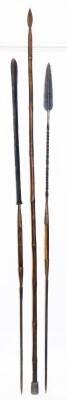 Three various African tribal spears, to include one with an elaborate arrowhead top with turned metal handle and wooden turned centre section with plain banding, 74cm high, and two others. (3) - 8