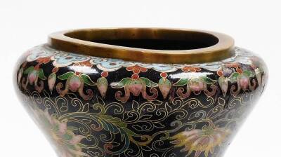 A Chinese cloisonné bulbous vase with onion neck, decorated with flowers, predominately in pink, green and blue, on a black ground, Qing dynasty, 19thC, 31cm high. (AF) - 7