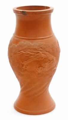 A Japanese Tokoname terracotta vase, decorated in relief with a dragon in cloud below a Greek style key fret band, impressed marks to the base. Meiji period, 24cm high.