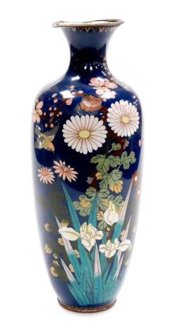 A Meiji period Japanese cloisonne baluster vase, decorated with flowers on a blue ground, 35cm high. (AF)