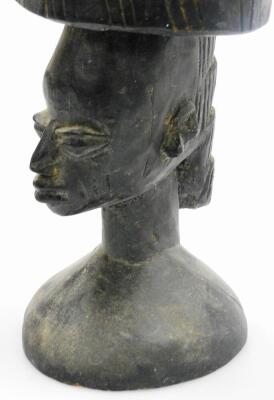 A heavily carved ebonised African tribal totem style figure, formed as two figures with elaborate features on a circular base, 54cm high. - 6