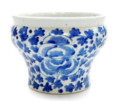 A late 19thC Chinese blue and white jardiniere, of waisted form painted with flowers and leaves, 20.5cm diameter, 15cm high.