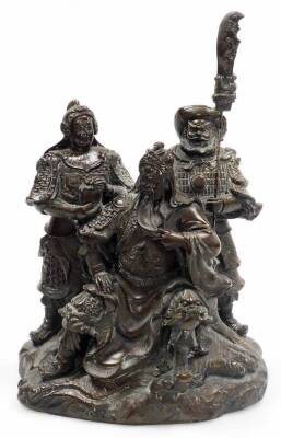 A Chinese bronzed spelter figural group, of a seated bearded general with two attendants on a rock work base, unmarked, 19thC, 37cm high.