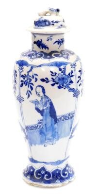 A Chinese blue and white porcelain baluster jar and cover, decorated with panels of women alternating with birds of birds and flowering branches, pseudo four character Kangxi mark to base, 28cm high.