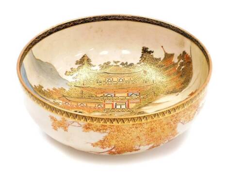 A Japanese Satsuma bowl, decorated with women walking in front of The Golden Pavilion in Kyoto, the exterior with irises, chrysanthemums and maple foot, the base signed Hakuzan, Meiji period, 18cm diameter.