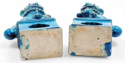 A pair of Chinese turquoise glazed pottery dogs of fo, each on shaped partially pierced bases, unmarked, 23cm high. (2) - 5