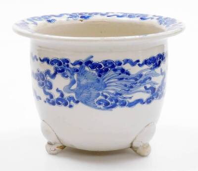 A Japanese porcelain jardiniere, the rim decorated with flowers, the body with a band of ho-o birds among clouds of flowers, on three moulded feet, probably Meiji period, 23cm diameter. - 3