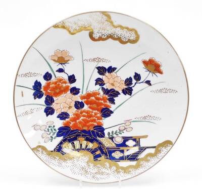 A late 20thC Japanese charger, in an Imari style palette, decorated with flowers with gilt highlights, marked to base, 37cm diameter.