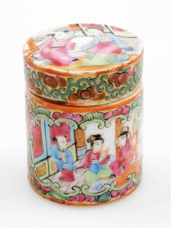 A 19thC Canton famille rose cylindrical jar and cover, the lid decorated with figures in an interior setting, the main body decorated with panels of birds, insects and flowers and further interior scenes, 7cm high.